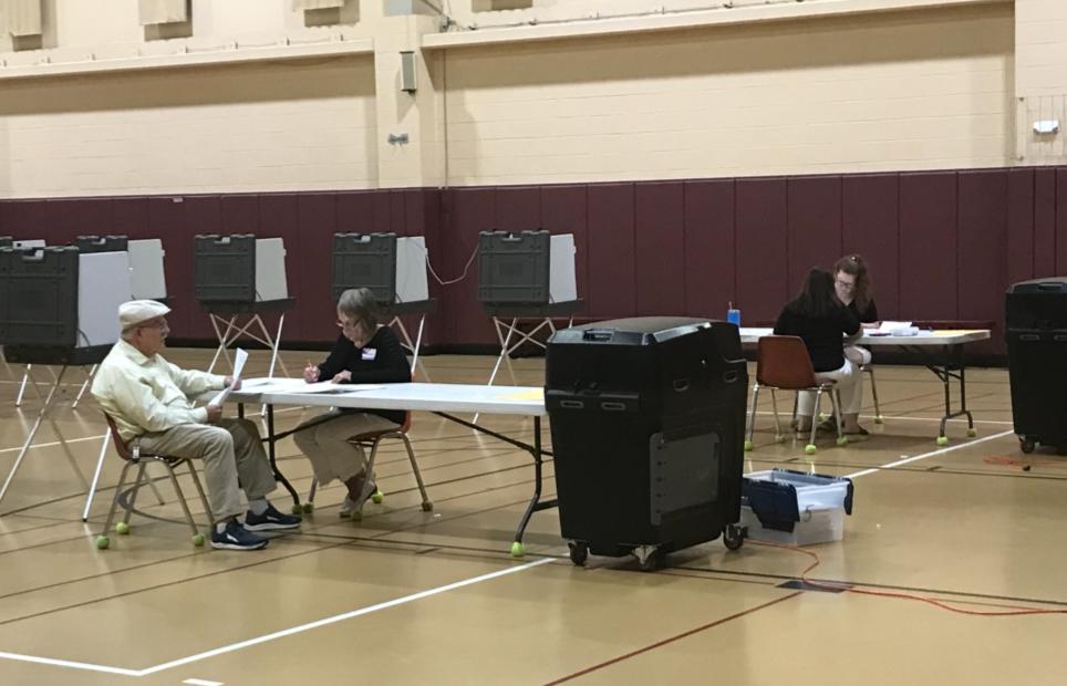 Officials hand count ballots